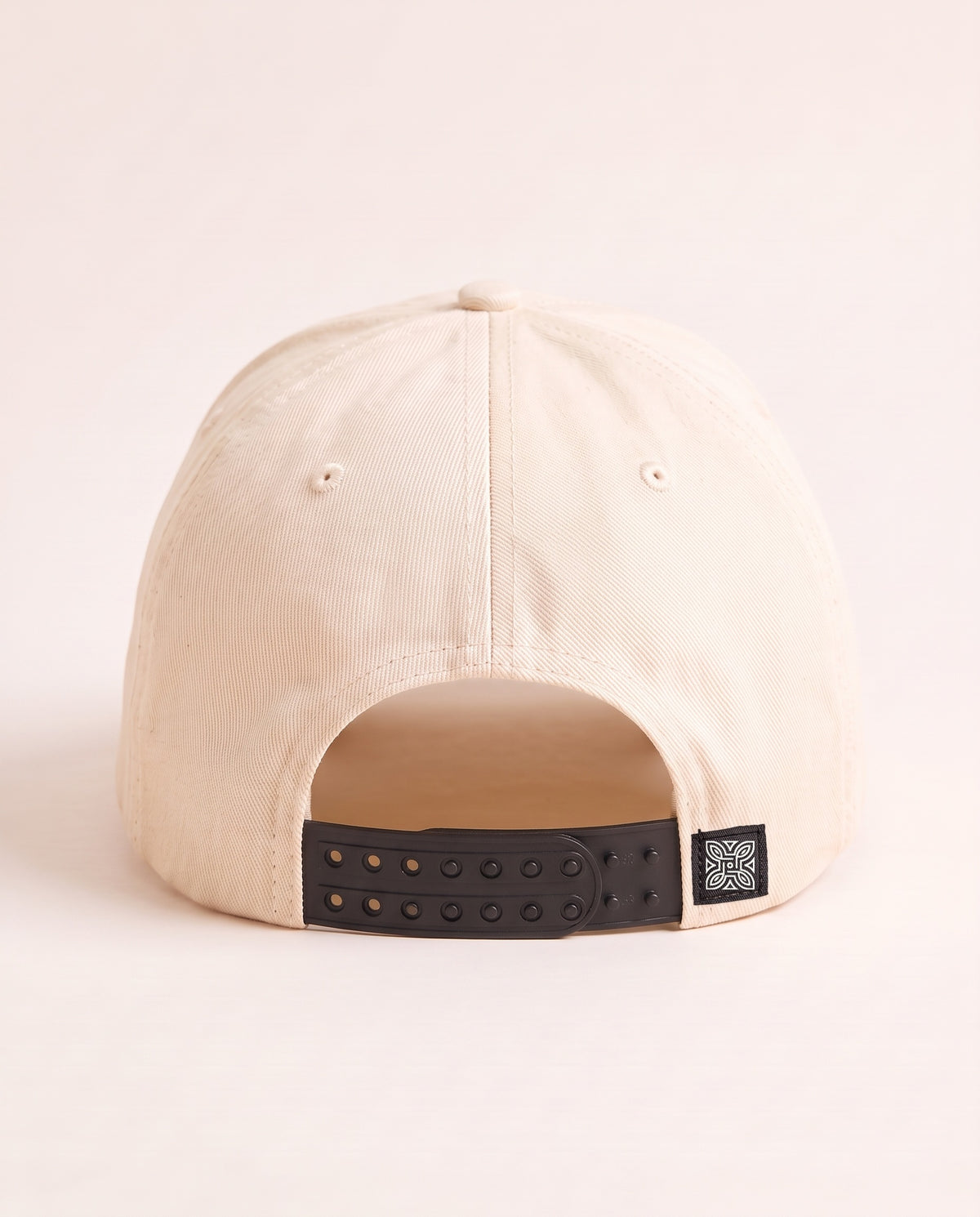Maison Cap in Cream, back: double-row snapback with embroidered knot tab